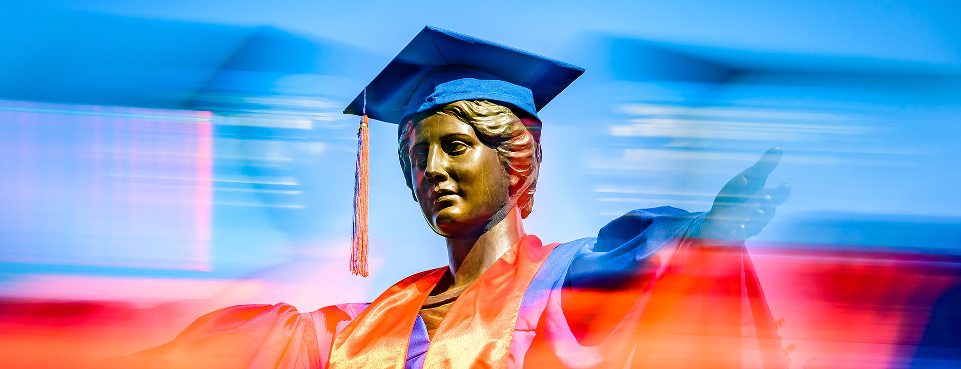 Alma Mater in orange with a blue graduation cap.