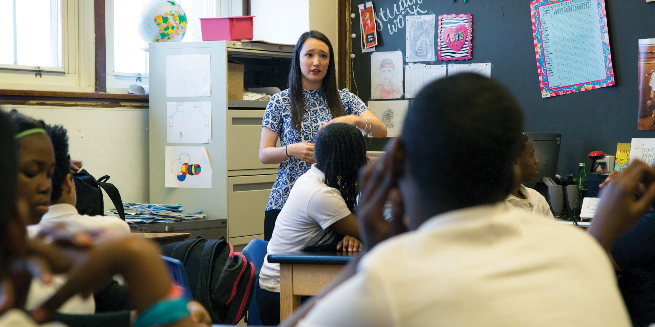 Image of teacher speaking to class